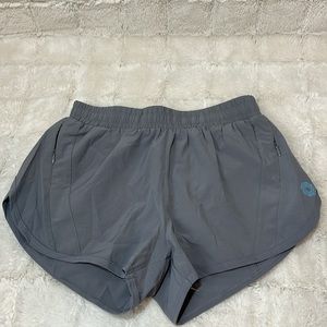 Light gray athletic shorts with built in Spanx and pockets